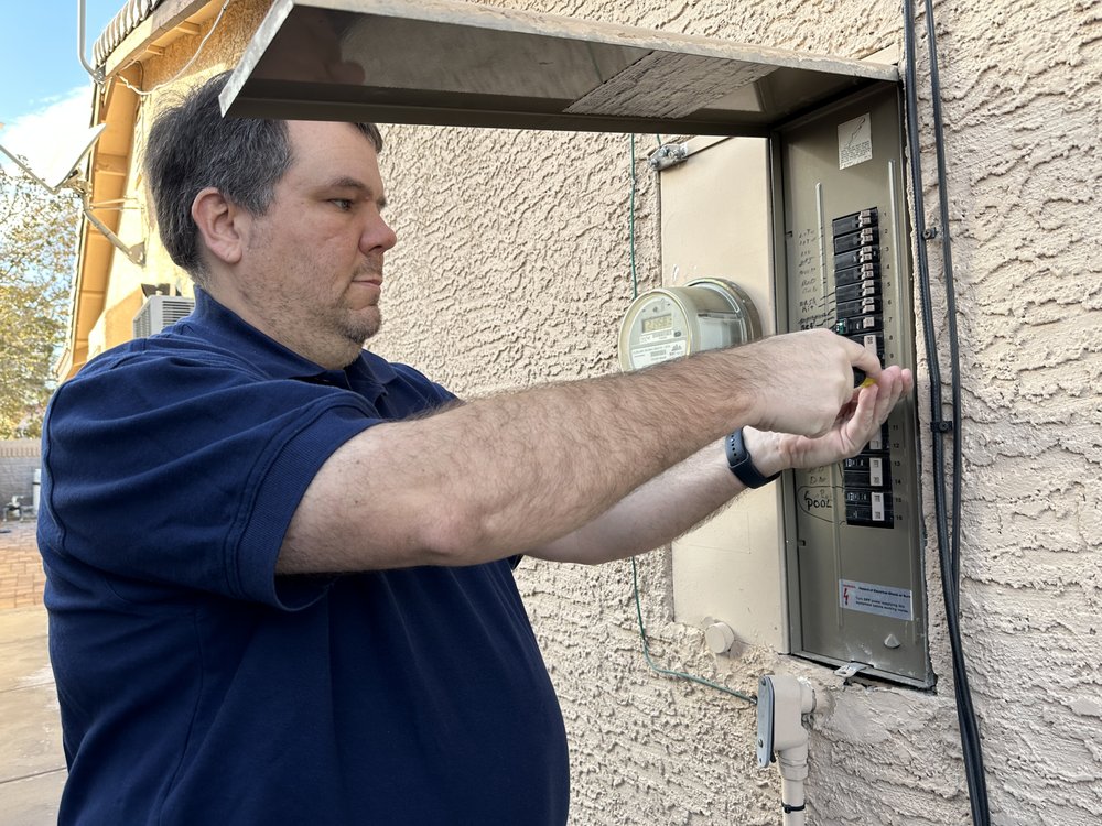NV Inspection Services inspector examining an electrical panel